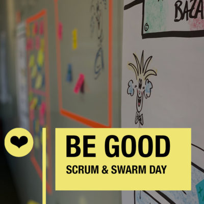 Colorful notes on a wall promote collaboration for Scrum and Swarm Day with a cheerful character illustration.