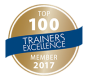 Top 100 Trainers Excellence Mitgliedsmedaille aus dem Jahr 2017 in goldfarbenem Design.